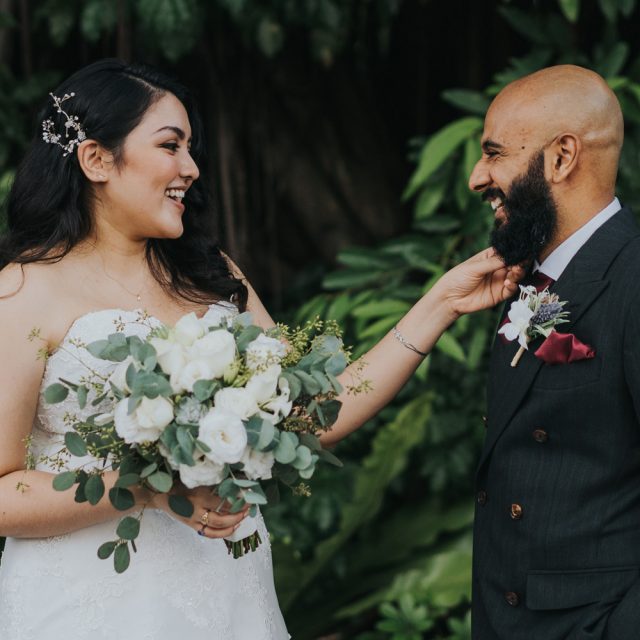 a couple taking their portrait on their wedding day